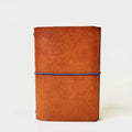 Olive, Ivy & Co. trifold leather journal in cognac