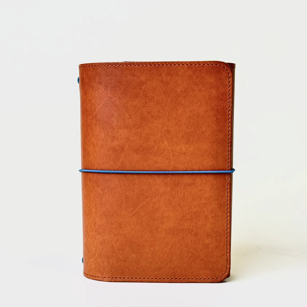 Olive, Ivy & Co. trifold leather journal in cognac